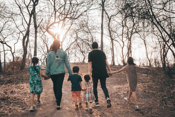 Family walking in forest